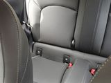 the back seats of a car with a seat belt in the back of it