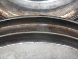 a close up of a set of metal pans on a table