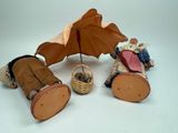 two stuffed animals that are sitting under an umbrella