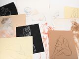 many different types of drawings on a table