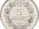 a close up of a five frans coin with a wreath on it