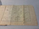 a piece of paper with diagrams on it on a table