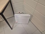 a white heater sitting on the floor in a corner