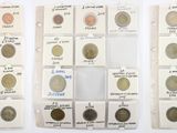 several different types of coins are displayed in a display case