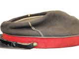 a hat that has a red band on it
