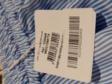 a label on a blue and white striped shirt