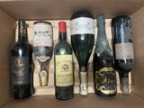 many bottles of wine in a box on the table