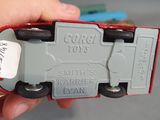 a person holding a toy truck in their hand