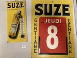 yellow and red sign with the number 8 on it next to a thermometer