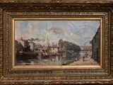 painting of a river scene with boats and buildings in a gold frame