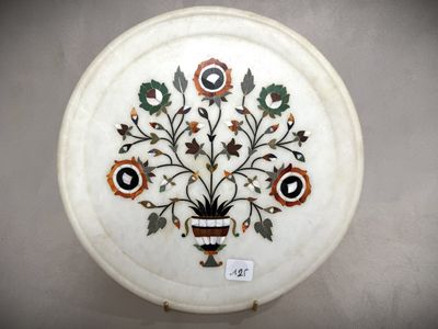 a white plate with a floral design on it