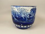 a blue and white bowl with a pattern on it