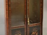 pair of antique wooden display cabinets with glass doors on each side