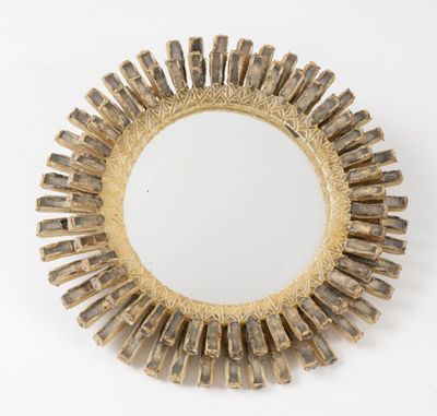 a close up of a mirror on a white surface with a white background