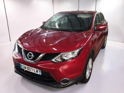 the red nissan qx - v is parked in a white room