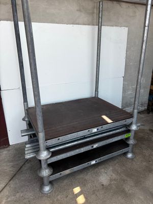 an image of a metal bed frame with a wooden top