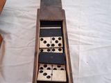 a wooden box that has a domino game in it