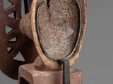 an image of a wooden sculpture with a magnifying lens on top of it