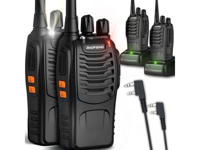 two walkie talkies with a charger and a charger on a white background