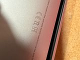 a close up of the back of an iphone with the screen partially open