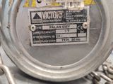a close up of a metal object with a tag on it