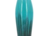 a blue vase that is sitting on a table