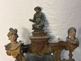 a statue of a man and a woman sitting on a bench