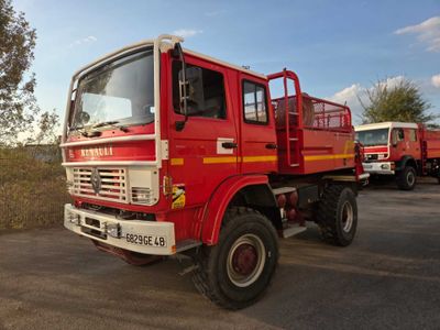 a red fire truck that is parked in a parking lot