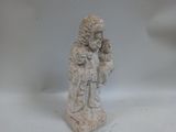 a small statue of a woman holding a baby