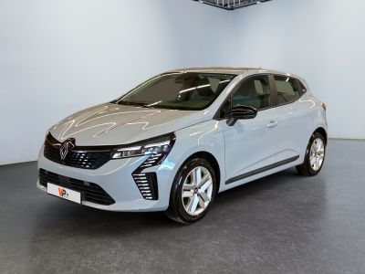 a silver car is parked in a room with a ceiling fan