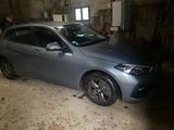 a car that is in a garage with a lot of stuff on it