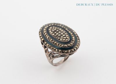 a close up of a ring on a white surface with a white background