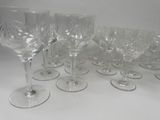 a lot of wine glasses sitting on a table