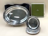 silver plate with a mirror and a box on a table