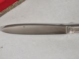 a knife that is laying on a table