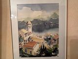 a picture of a painting hanging on the wall of a bathroom