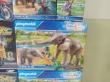 a lot of playmobil toys that are stacked on top of each other