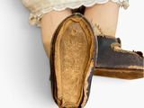 a close up of a person ' s legs with a pair of shoes