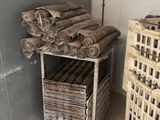 a stack of rolls of toilet paper next to a stack of crates