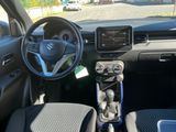 the interior of a car with a steering wheel and dashboard controls
