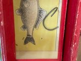 a picture of a fish that is hanging on a wall
