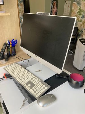 a computer on a desk with a keyboard and mouse