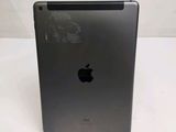 an apple ipad is sitting on top of a white table