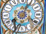 a clock that is on the table with a pair of scissors