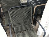 a lot of chairs that are sitting on the ground