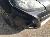a close up of a car that has a dent in it