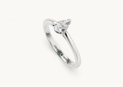 a white gold engagement ring with a pear shaped diamond