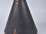 a black cone with a leather strap on it