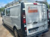 a white van that is parked on the side of the road