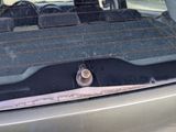 a close up of a car ' s windshield with a nut on it